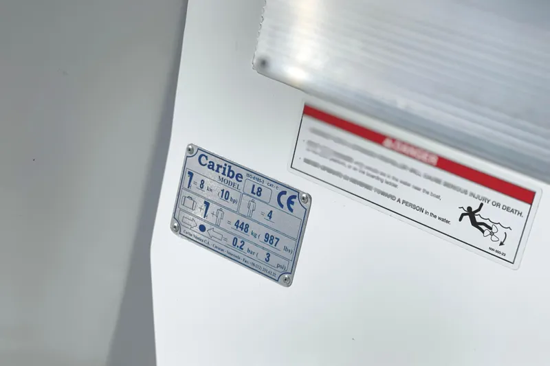 Slide: The Image of Caribe L8 2025 model label with specifications and safety warning. - 6