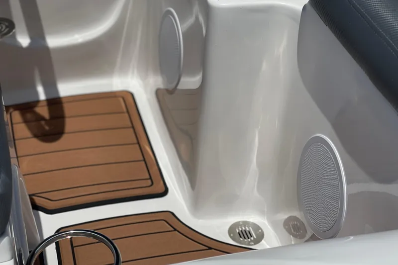 Slide: The Image of Interior of 2025 Caribe DL11 boat with wooden flooring and built-in speakers. - 27