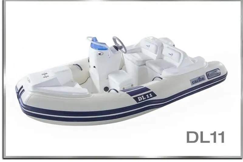 Slide: The Image of 2025 Caribe DL11 inflatable boat with white and blue design, featuring seating and steering console. - 36