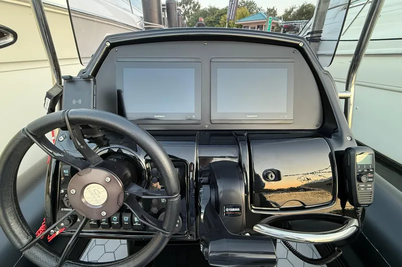 Slide: The Image of Steering console of 2018 Grand Goldenline G650 HGLF Custom with dual Garmin displays. - 11