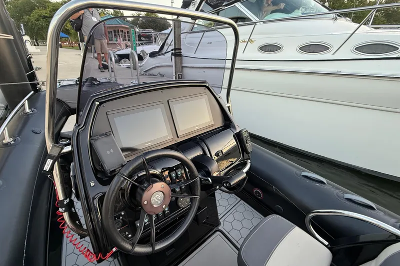 The Image of 2018 Grand Goldenline G650 HGLF Custom boat docked beside a larger yacht. - 2