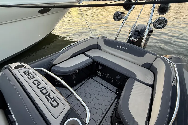 Slide: The Image of Interior of 2018 Grand Goldenline G650 HGLF Custom boat with sleek seating and steering wheel. - 4