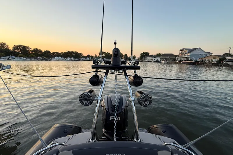 Slide: The Image of 2018 Grand Goldenline G650 HGLF Custom boat interior with seating and motor, docked on water. - 5