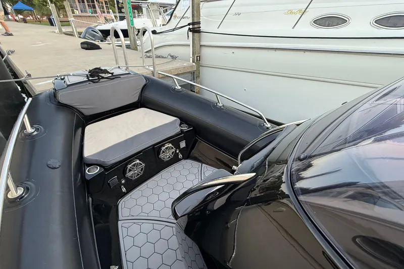 Slide: The Image of 2018 Grand Goldenline G650 HGLF Custom boat docked, featuring sleek interior and modern design. - 8