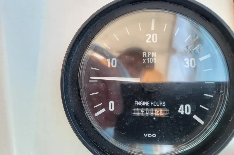 Slide: The Image of Close-up of Mainship 34 Pilot 2000 tachometer showing 1400 engine hours. - 22
