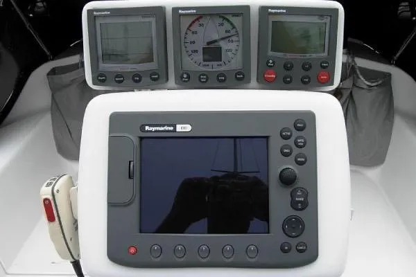 Slide: The Image of Control panel of a 2005 Catalina 320 sailboat with Raymarine navigation instruments. - 11