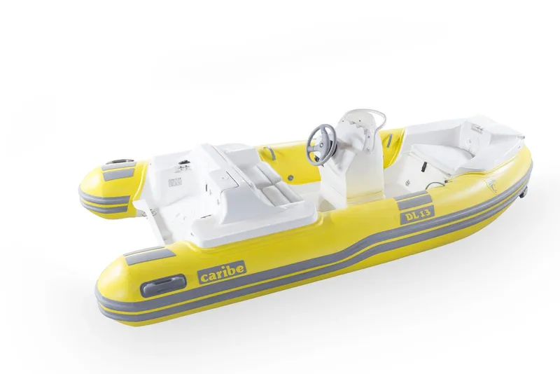 Slide: The Image of Yellow Caribe DL13 inflatable boat, 2025 model, with steering console and seating. - 6