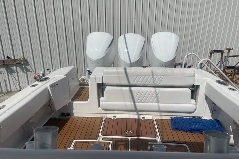 Slide: The Image of 2008 Edgewater 370CC boat interior with triple engines and teak flooring. - 9