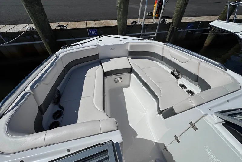 Slide: The Image of 2018 Chaparral 230 Suncoast boat interior with spacious seating and cup holders. - 10