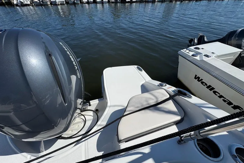 Slide: The Image of 2018 Chaparral 230 Suncoast boat with Yamaha engine, docked beside Wellcraft. - 15