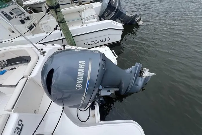 Slide: The Image of 2018 Chaparral 230 Suncoast boat seat with deluxe branding and chrome handle. - 6