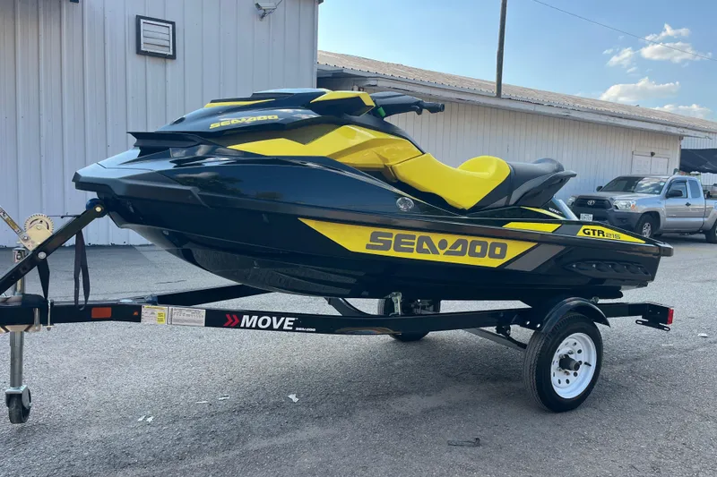 Slide: The Image of 2016 Sea-Doo GTR 215 jet ski on trailer at Cransh Auto Sales. - 2