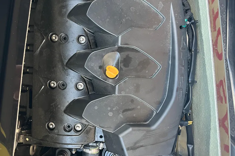 Slide: The Image of Open storage compartment of 2016 Sea-Doo GTR 215, featuring yellow exterior. - 20