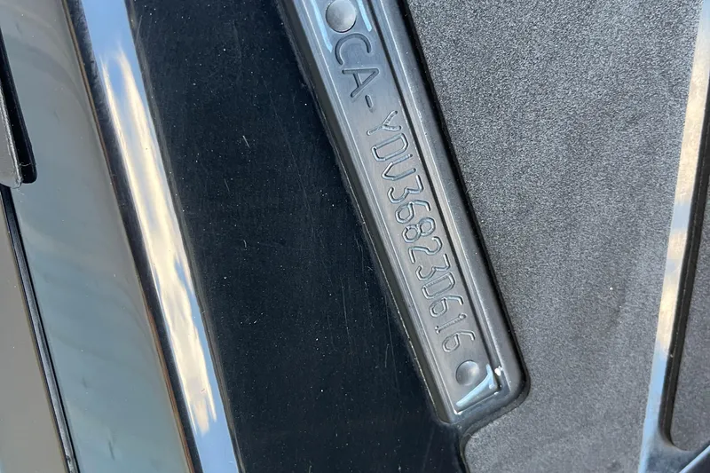 Slide: The Image of 2016 Sea-Doo GTR 215 emission control label on black surface. - 22