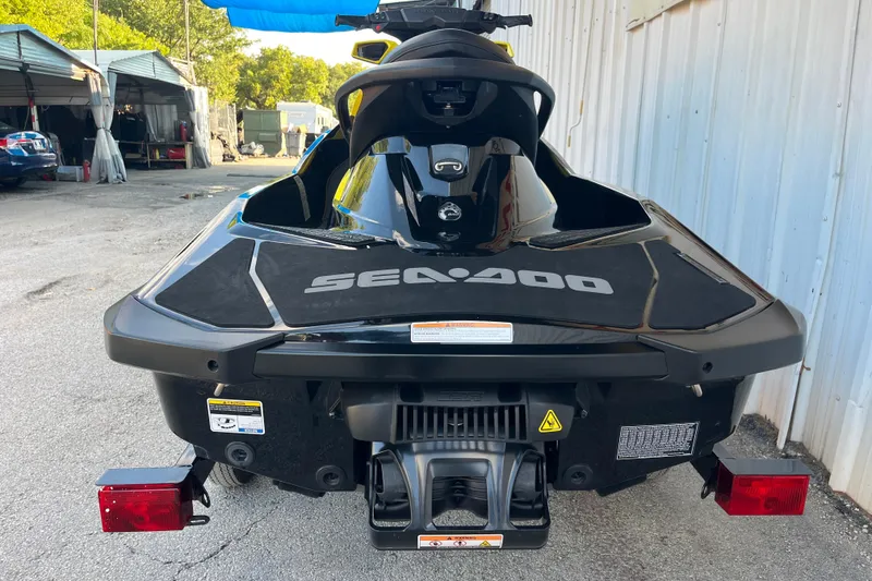 Slide: The Image of 2016 Sea-Doo GTR 215 jet ski on trailer, parked outside a building. - 24