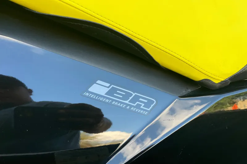 Slide: The Image of 2016 Sea-Doo GTR 215 jet ski, close-up of sleek black exterior and BRP logo. - 26