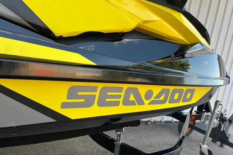 Slide: The Image of Trailer wheel and fender for 2016 Sea-Doo GTR 215 on asphalt surface. - 31