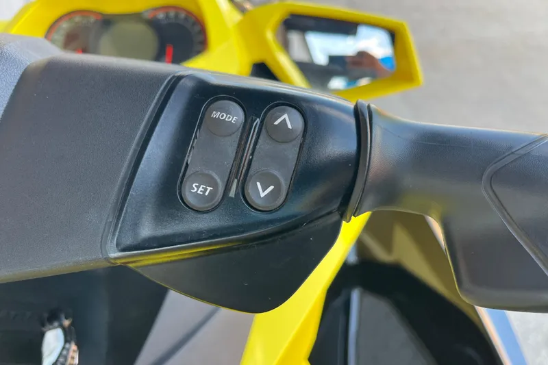 Slide: The Image of 2016 Sea-Doo GTR 215 jet ski dashboard with controls and safety instructions. - 33