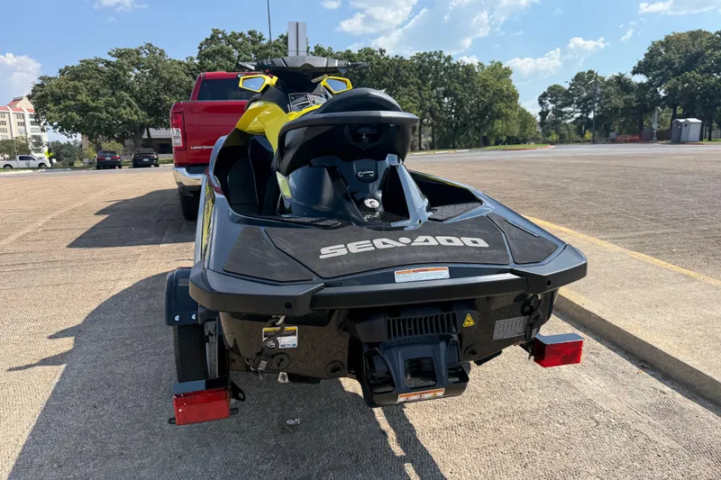Slide: The Image of 2016 Sea-Doo GTR 215 jet ski on trailer, parked outdoors. - 46