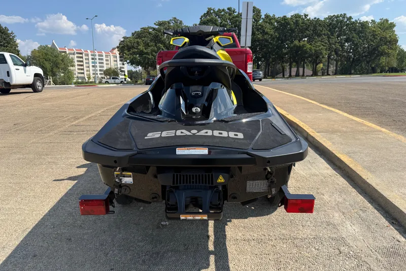 Slide: The Image of 2016 Sea-Doo GTR 215 jet ski on trailer, parked in sunny outdoor setting. - 47