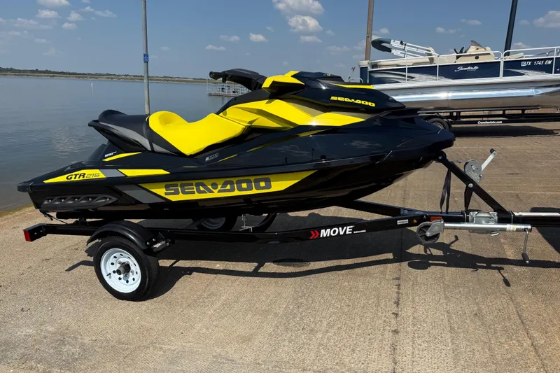 Slide: The Image of 2016 Sea-Doo GTR 215 jet ski on trailer by the lake. - 52