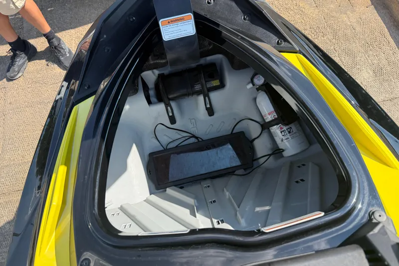 Slide: The Image of 2016 Sea-Doo GTR 215 storage compartment with safety equipment and accessories. - 60