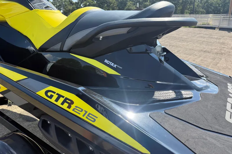 Slide: The Image of 2016 Sea-Doo GTR 215 jet ski, featuring Rotax engine, yellow and black design. - 62