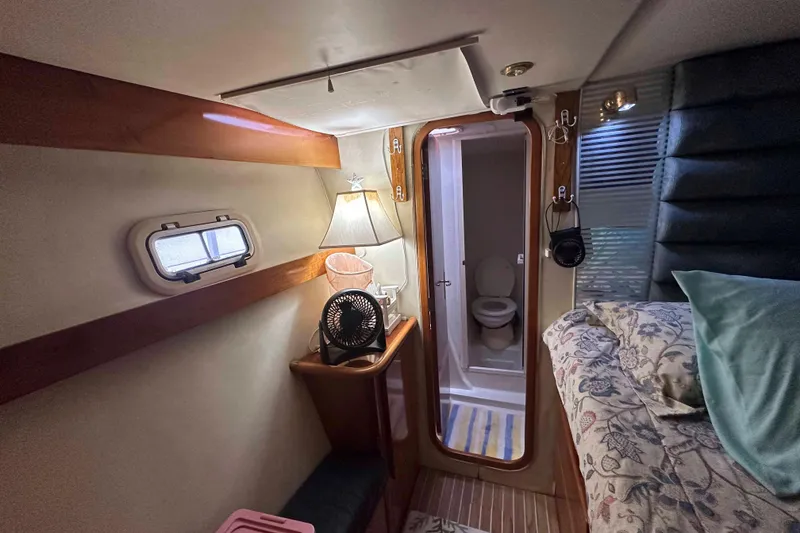 Slide: The Image of Cozy cabin interior of 1993 Jeantot Euphorie 40 with bed, lamp, and bathroom. - 11