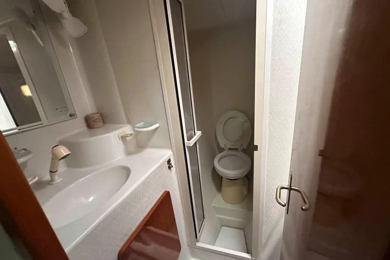 Slide: The Image of Bathroom interior of 1993 Jeantot Euphorie 40 yacht, featuring sink and toilet. - 14