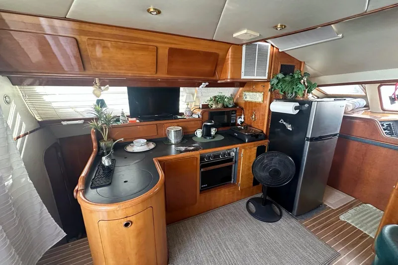 Slide: The Image of Interior of 1993 Jeantot Euphorie 40 yacht with kitchen, plants, and appliances. - 2