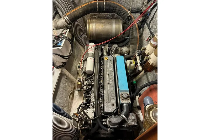 Slide: The Image of Engine compartment of a 1993 Jeantot Euphorie 40 catamaran, showcasing detailed mechanical components. - 20