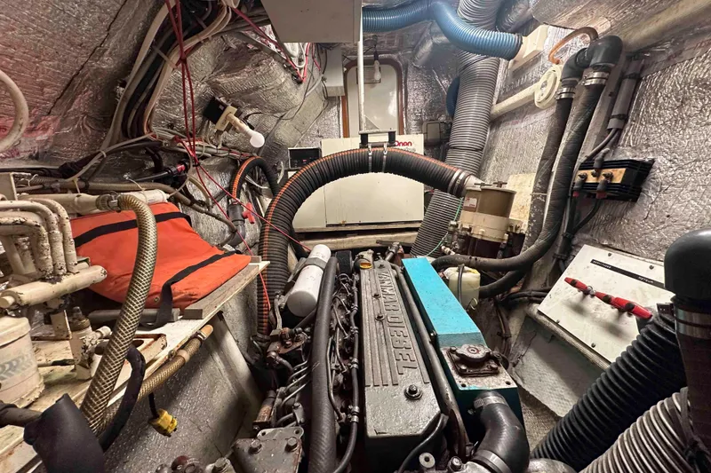 Slide: The Image of Engine room of a 1993 Jeantot Euphorie 40 catamaran, featuring a Yanmar diesel engine. - 21