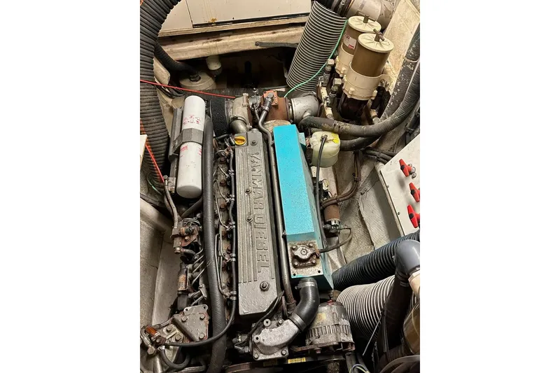 Slide: The Image of Engine compartment of a 1993 Jeantot Euphorie 40 catamaran, featuring a Yanmar diesel engine. - 23