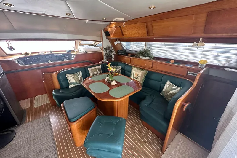 Slide: The Image of Interior of 1993 Jeantot Euphorie 40 yacht with elegant wood and leather seating. - 3