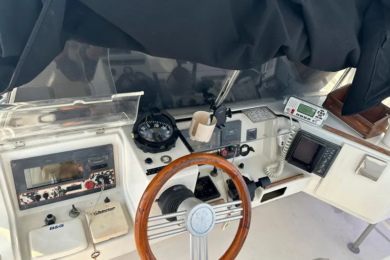 Slide: The Image of Cockpit of 1993 Jeantot Euphorie 40 with navigation instruments and wooden steering wheel. - 4