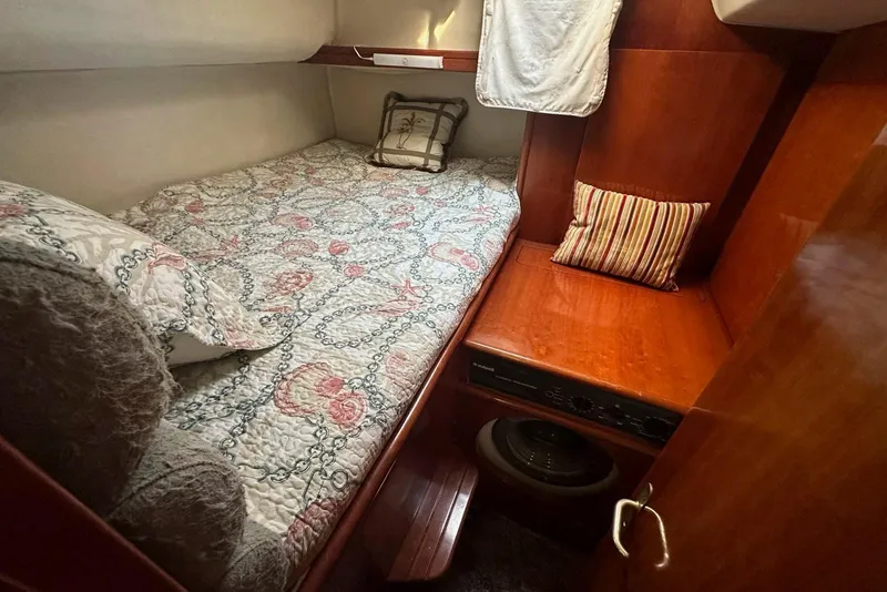 Slide: The Image of Cozy cabin interior of 1993 Jeantot Euphorie 40 with bed and wooden furnishings. - 8