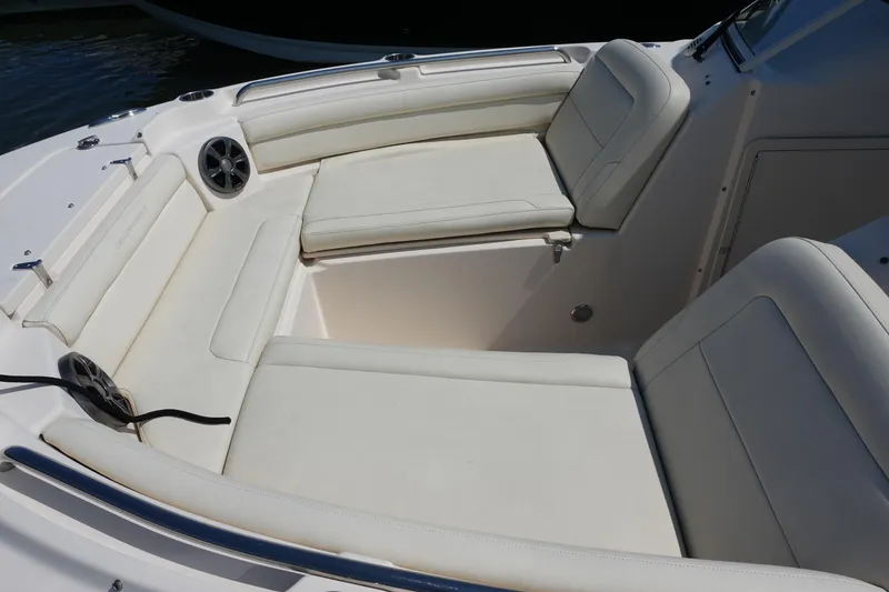 Slide: The Image of 2020 Grady-White Freedom 215 boat interior with white cushioned seating. - 11