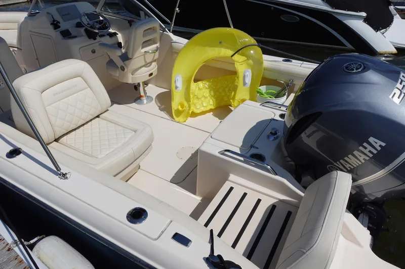 Slide: The Image of 2020 Grady-White Freedom 215 boat interior with Yamaha engine and yellow inflatable. - 14