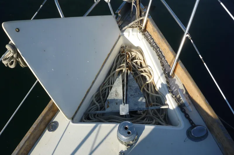 Slide: The Image of Bow of 1987 Bristol 35.5 sailboat with anchor and ropes. - 12