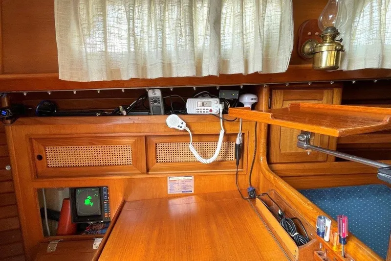 Slide: The Image of 1987 Bristol 35.5 yacht interior with navigation equipment and wooden cabinetry. - 21