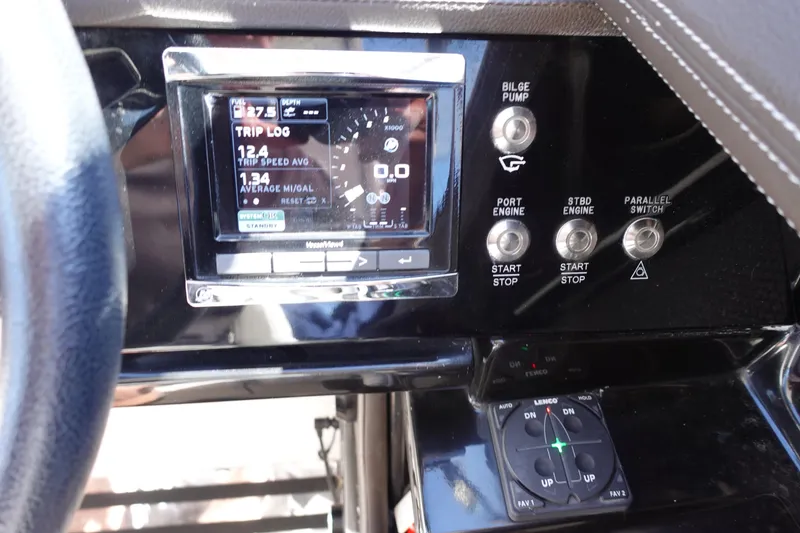 Slide: The Image of 2018 Sea Ray SLX 310 Outboard dashboard with trip log display and engine controls. - 14