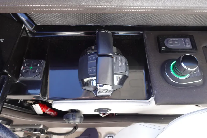 Slide: The Image of 2018 Sea Ray SLX 310 Outboard control panel with joystick and throttle controls. - 15