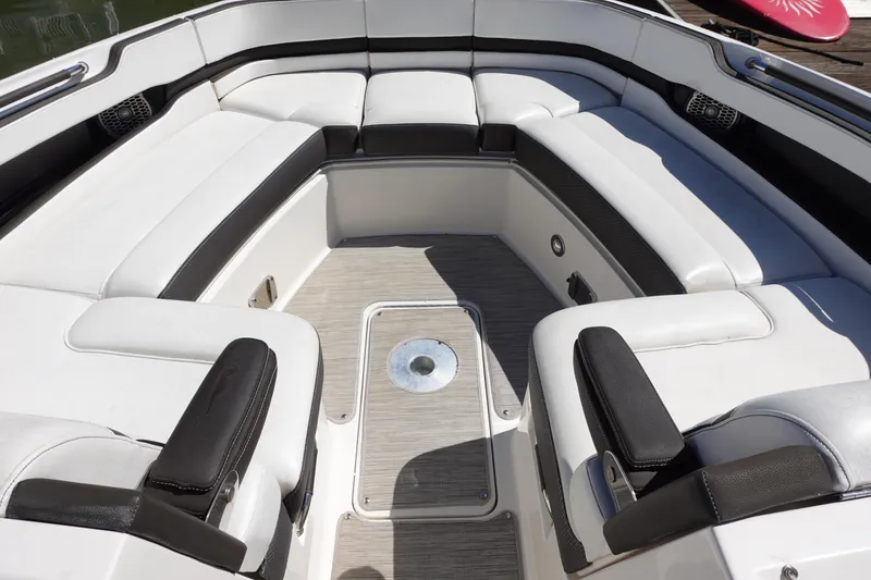 Slide: The Image of 2018 Sea Ray SLX 310 Outboard interior with white and black seating arrangement. - 18