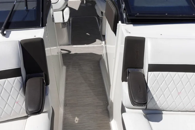 Slide: The Image of Interior seating of 2018 Sea Ray SLX 310 Outboard with quilted upholstery and armrests. - 19
