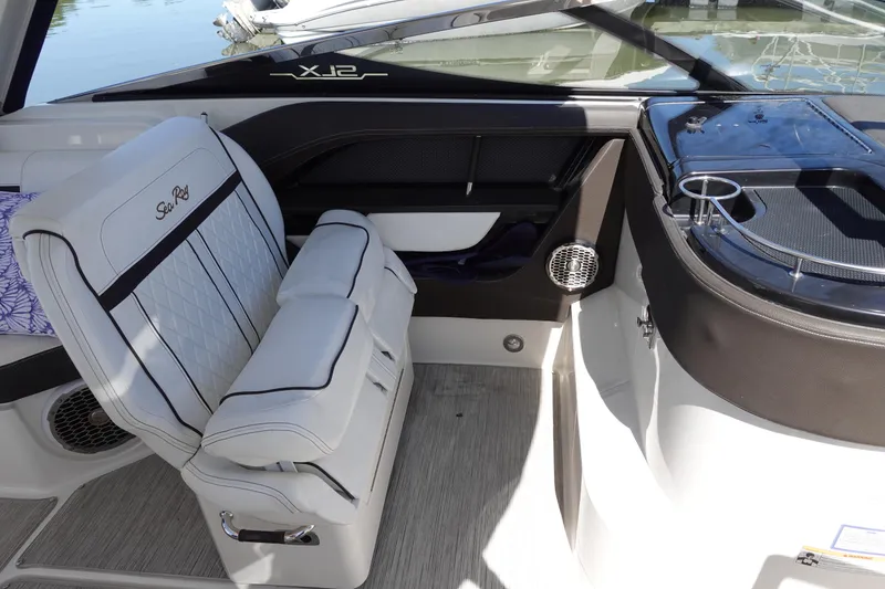Slide: The Image of 2018 Sea Ray SLX 310 Outboard interior with luxurious seating and sleek design. - 22