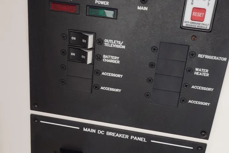 Slide: The Image of Main DC breaker panel on 2018 Sea Ray SLX 310 Outboard boat. - 27