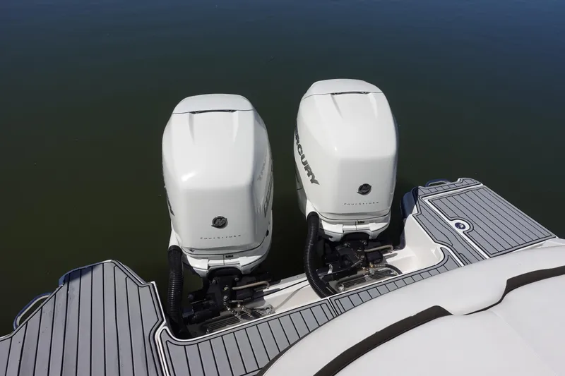 Slide: The Image of 2018 Sea Ray SLX 310 Outboard with twin Mercury engines on water. - 6