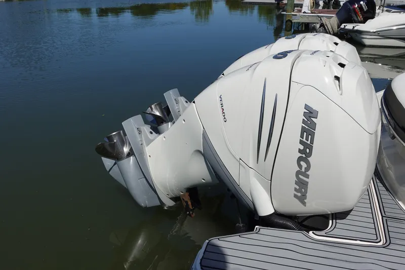 Slide: The Image of 2018 Sea Ray SLX 310 Outboard with twin Mercury Verado engines on water. - 7