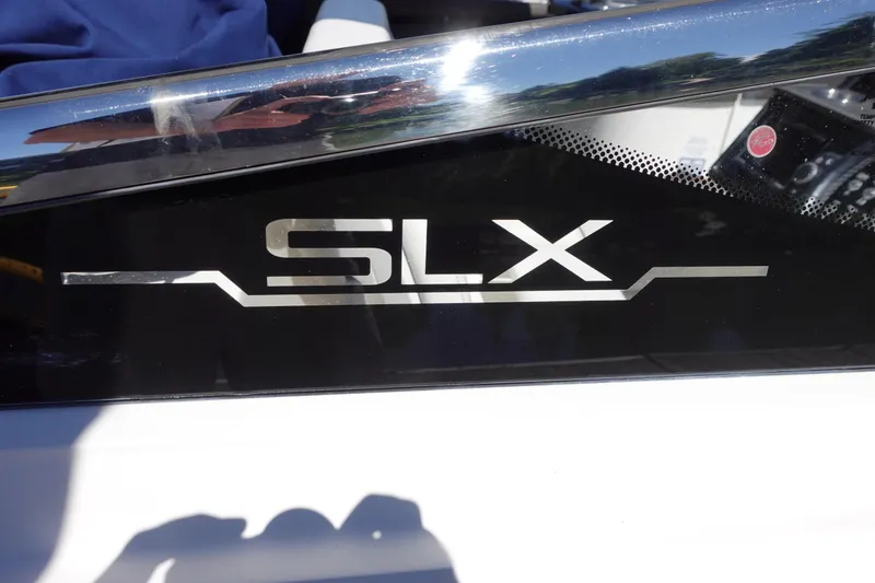 Slide: The Image of 2018 Sea Ray SLX 310 Outboard logo on sleek black surface. - 9