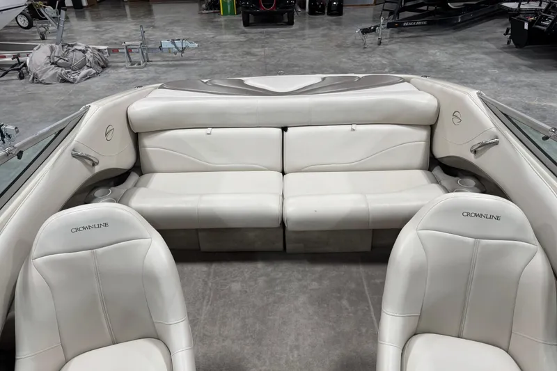 Slide: The Image of Interior of a 2000 Crownline 225 BR boat with white leather seating. - 7